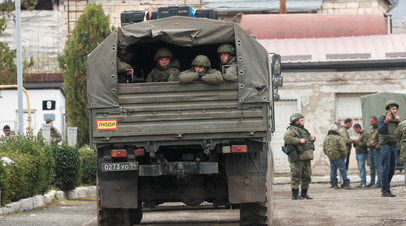 Russian peacekeepers sit in a military truck forces near Stepanakert in the region of Nagorno-Karabakh, November 13, 2020.