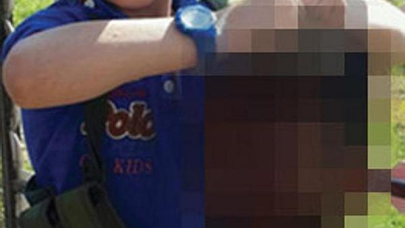 Австралийский джихадист выложил в Twitter фото своего сына, держащего отрубленную голову
